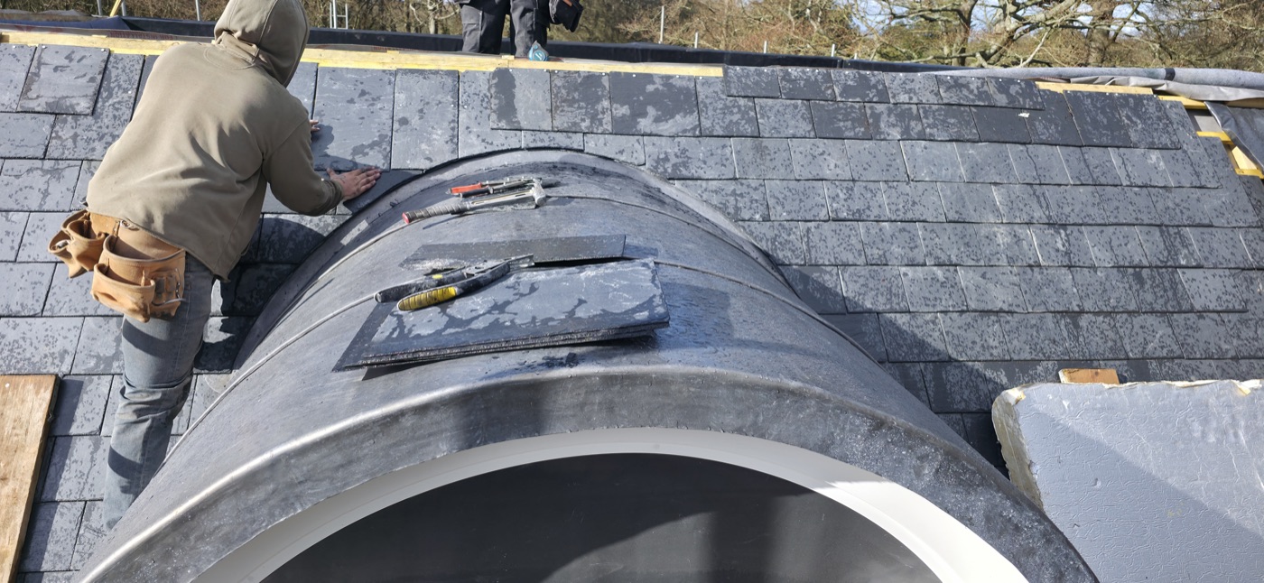 Craftsman fitting lead dome detail on slate roof