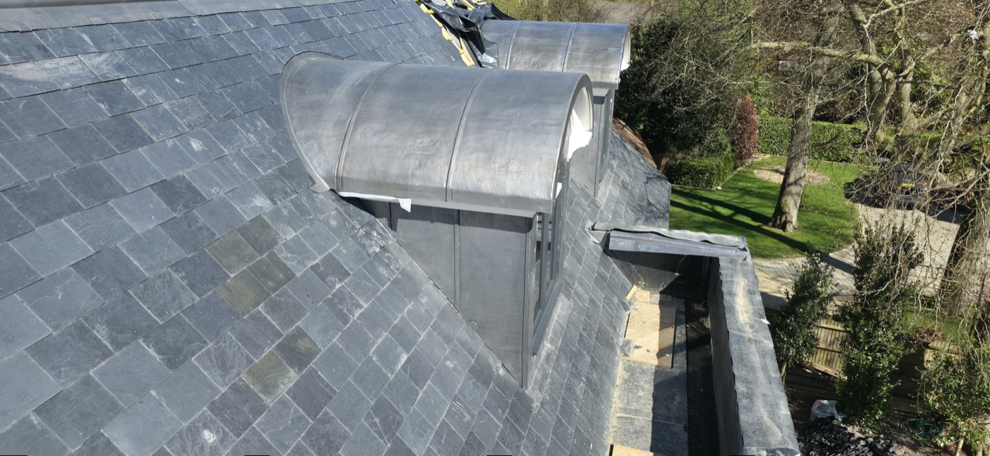 Completed bespoke lead dome on natural slate roof