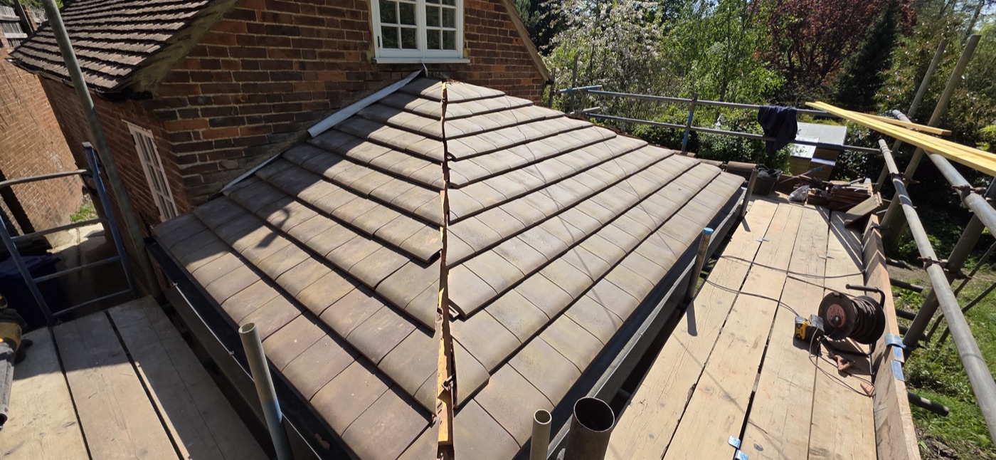 Completed concrete tile hip roof with ridge detail
