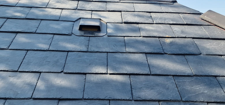 Natural slate close-up with ventilation tile