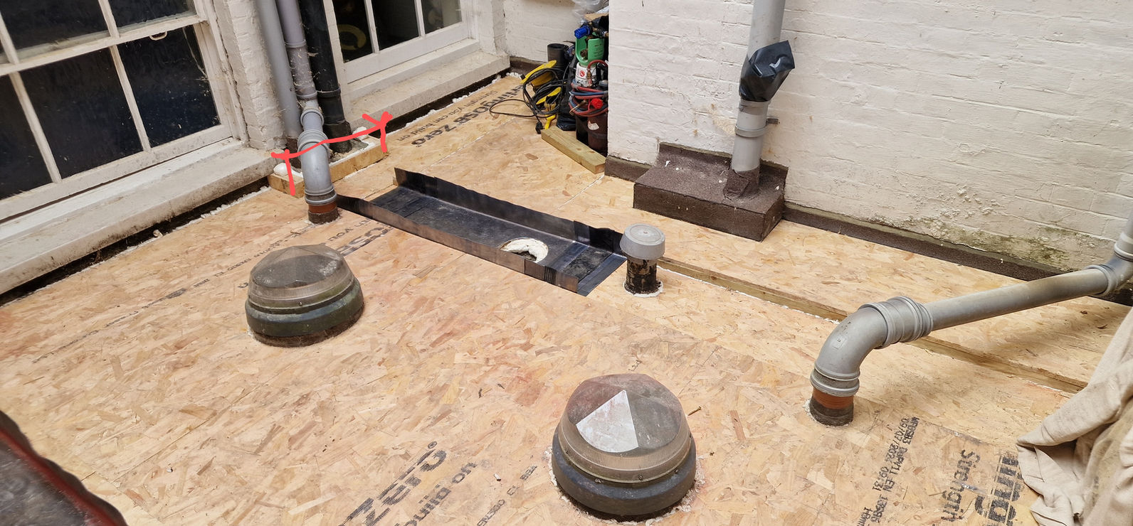 Flat roof deck with dome rooflights being prepared