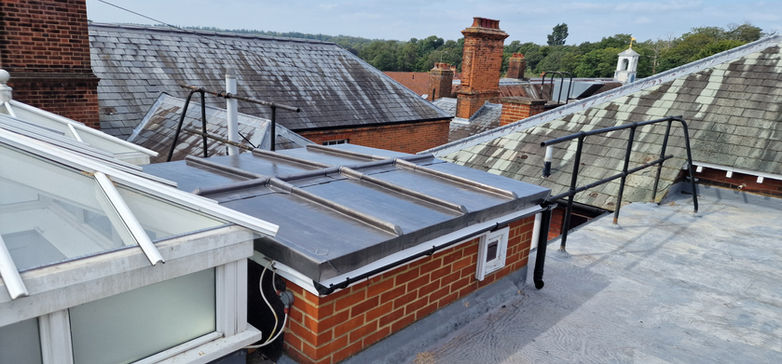 Heritage village roofscape with slate and lead valleys