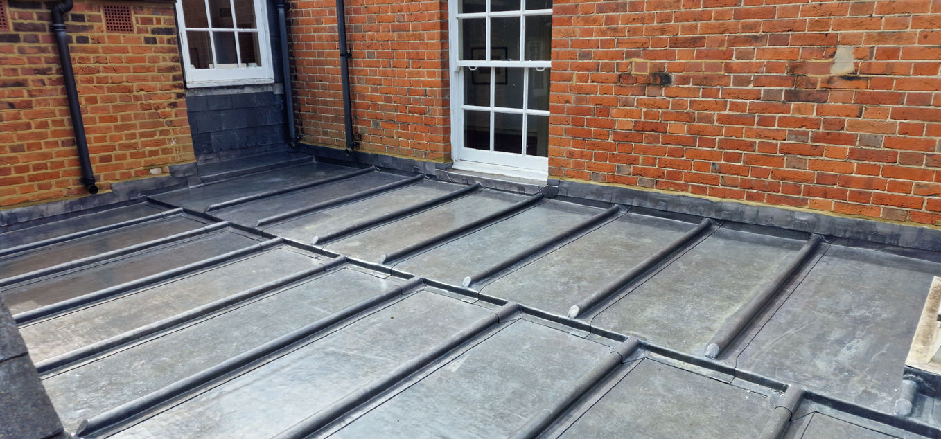 Large welted lead flat roof on Georgian building
