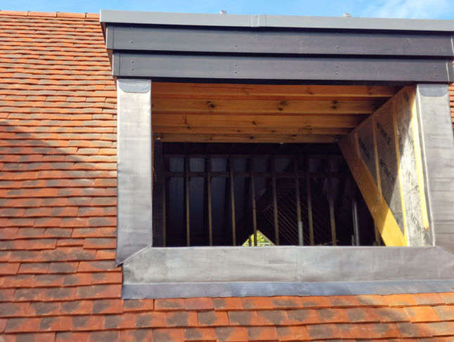 Lead flashing around dormer on clay tile roof