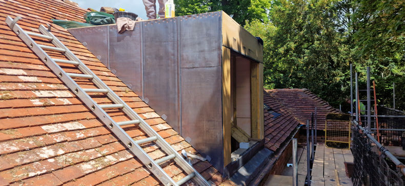 Lead dormer cladding installation on tile roof