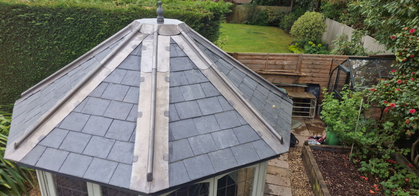 Octagonal natural slate roof, garden setting