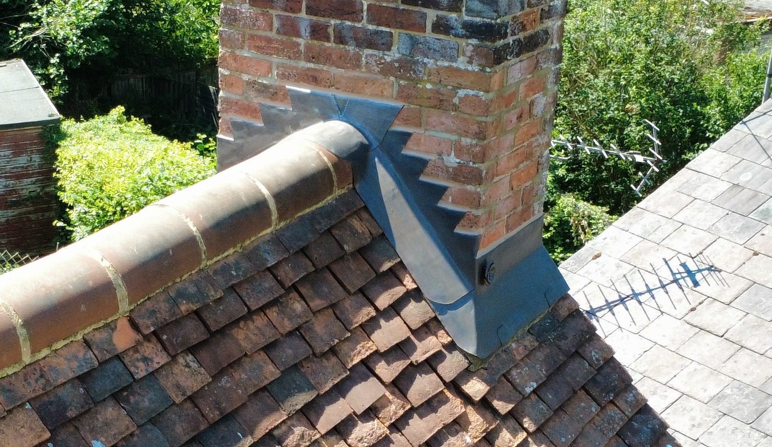 Chimney with new lead flashings and back gutter from above