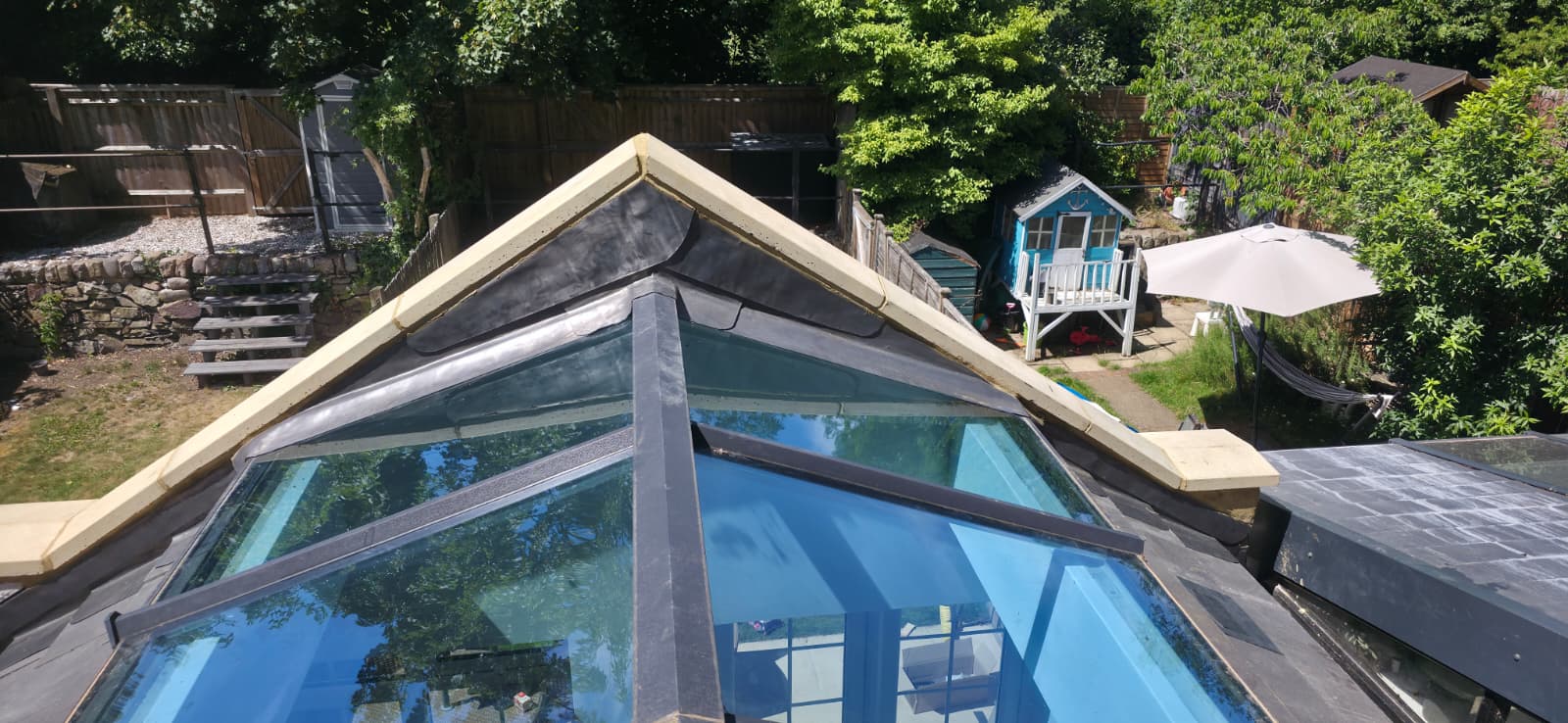 Slate roof and lead detailing around glass roof lantern